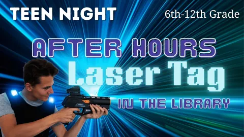 Boy holding blue laser tag gun and vest