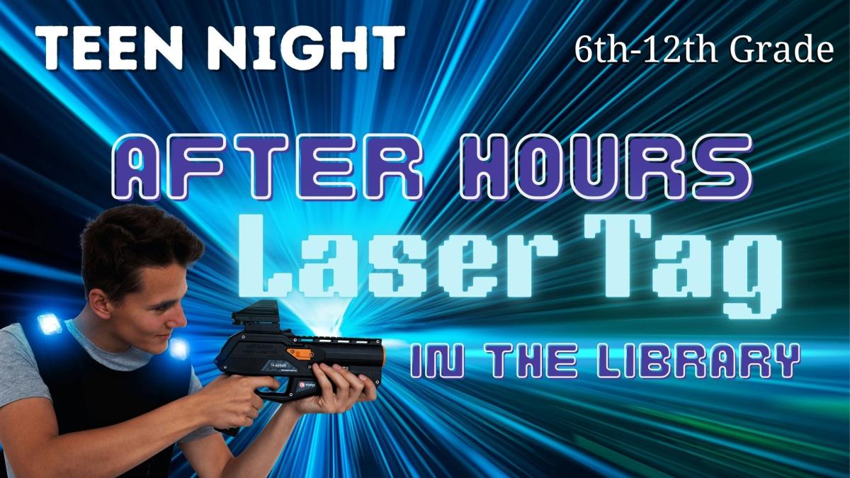 Boy holding blue laser tag gun and vest